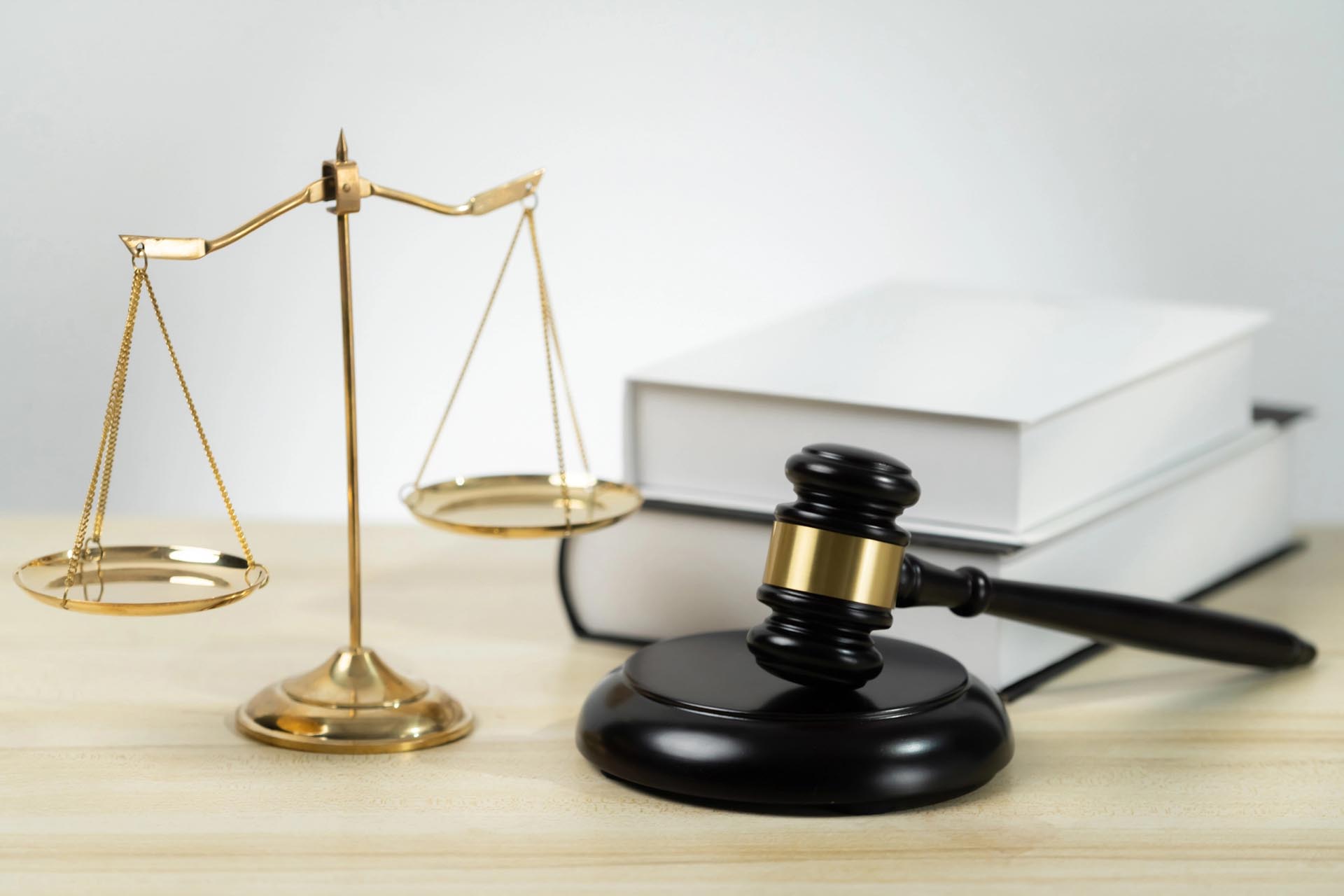 A gavel and scales of justice symbolize authority and fairness, representing diverse legal practice areas.